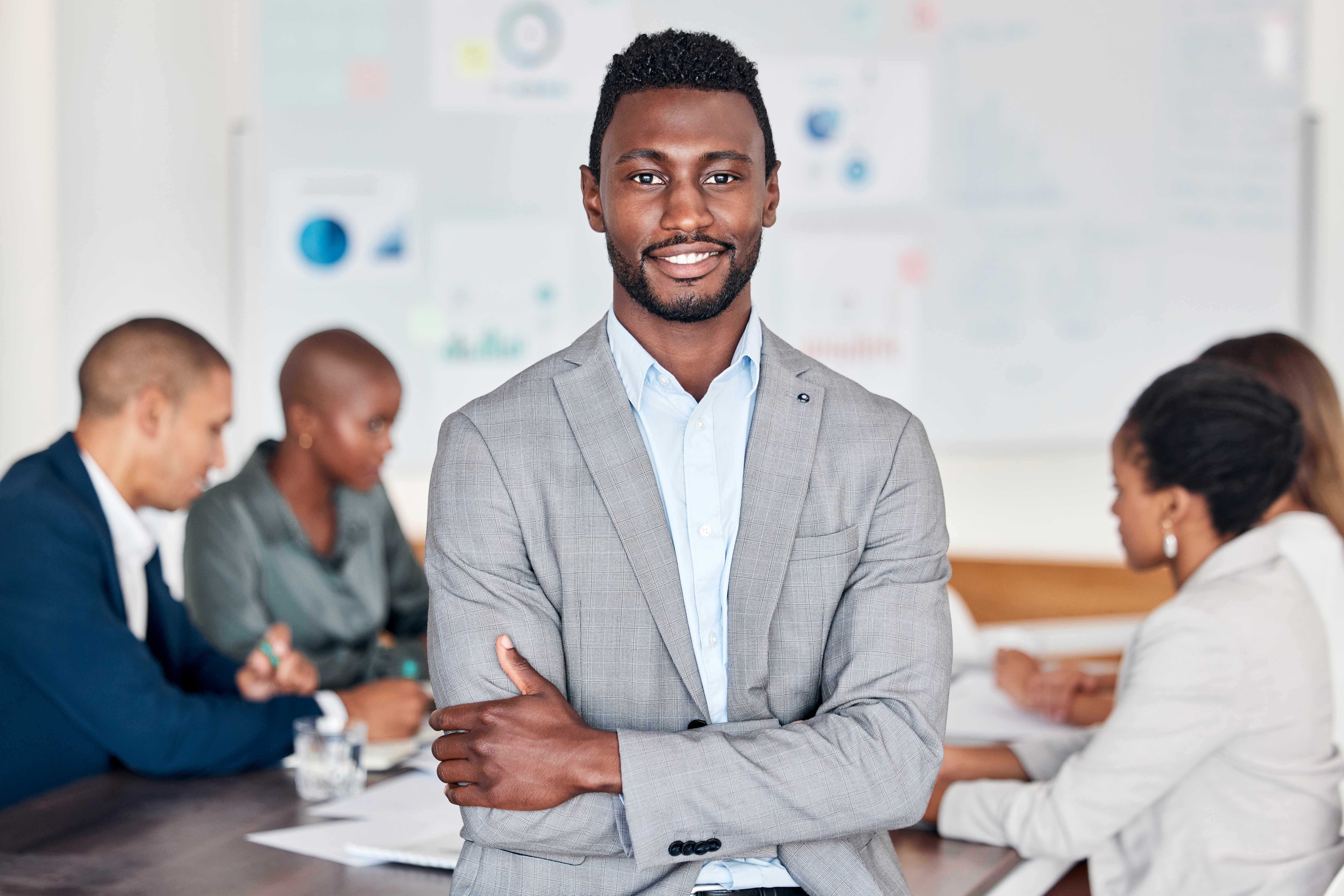 Leadership, meeting and planning with a black man and his business team in the boardroom for planni